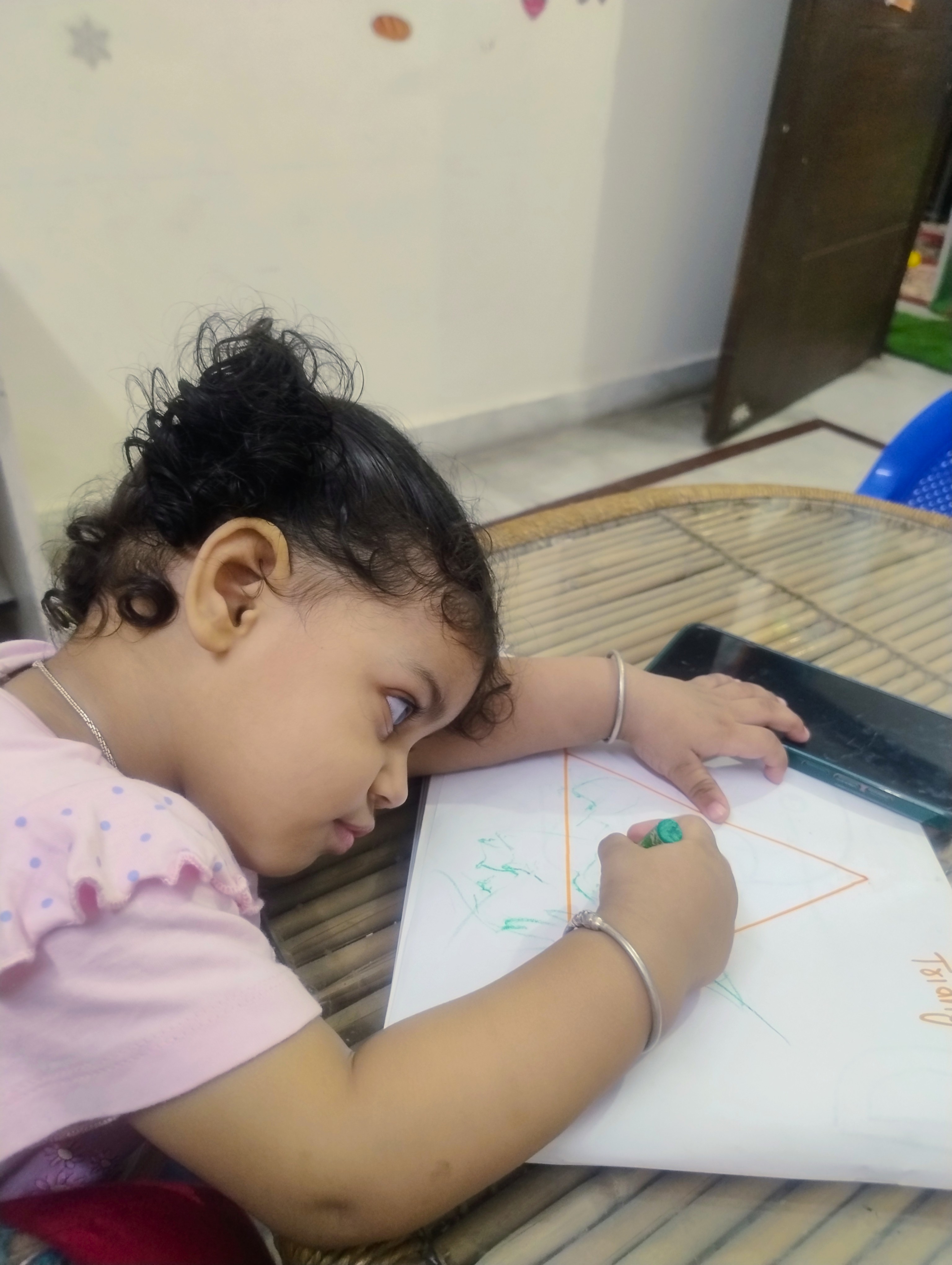 Three children engaged in a learning activity